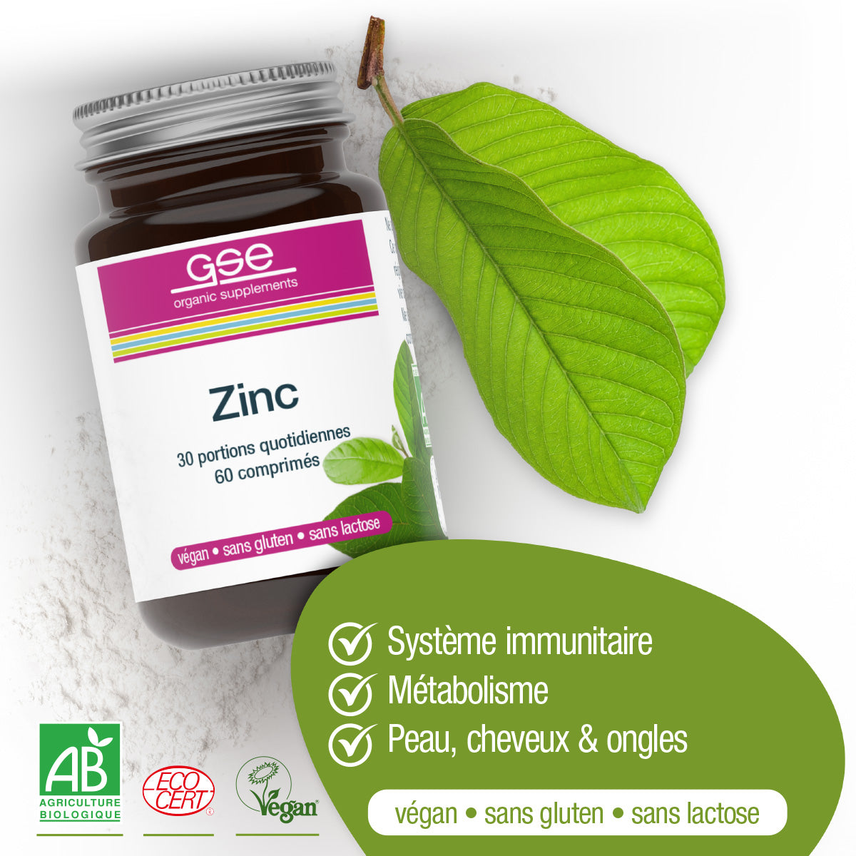 Eine Dose Zink Compact (Bio) FR von gse.organic.supplements ruht auf einem weißen Hintergrund mit einem grünen Blatt und Pulver. Highlights: Unterstützt Immunität, Stoffwechsel, Haut, Haare, Nägel. Vegane, glutenfreie und laktosefreie Etiketten sind abgebildet.